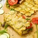 Cheesy zucchini flatbread wrap served with filling